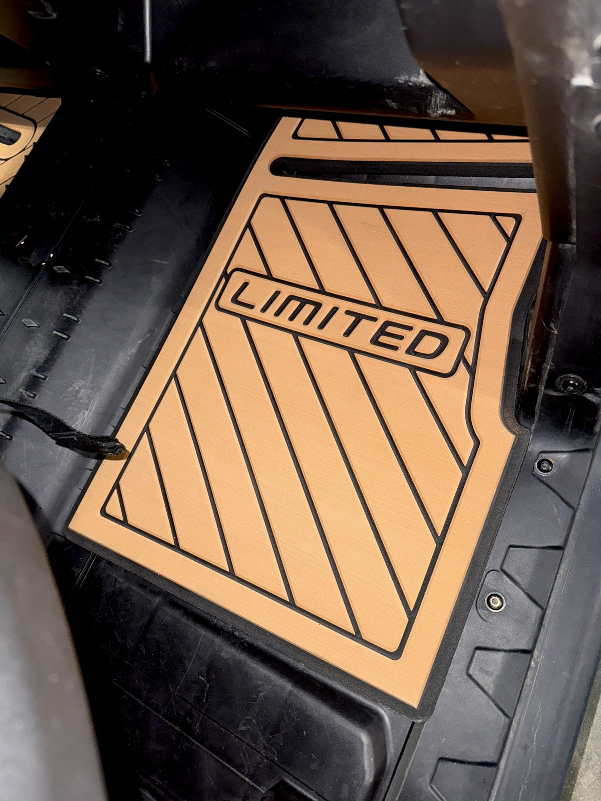 RADTECH CNC-cut floor mats installed in a 2016+ Can-Am Defender